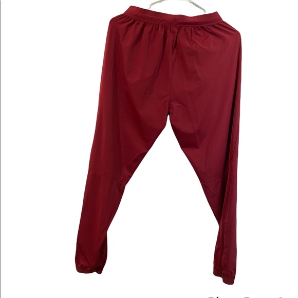 NIKE Women’s DRY-fit Burgundy RUNNING STADIUM/ JOGGER PANTS - Picture 3 of 6